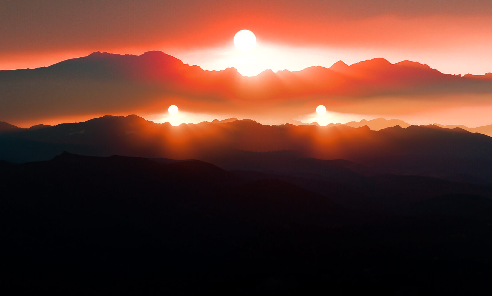 A stylized, multiple-exposure treatment of a mountain sunset with three glowing sun-like shapes stacked above the ridgeline.