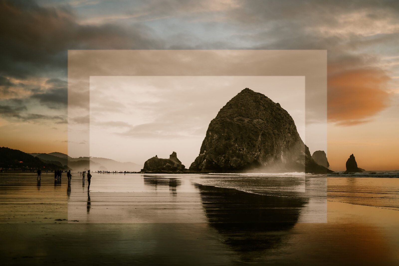 A warm-toned wide view of Haystack Rock at sunset with beachgoers on the sand; a translucent rectangle currently overlays the center of the frame.